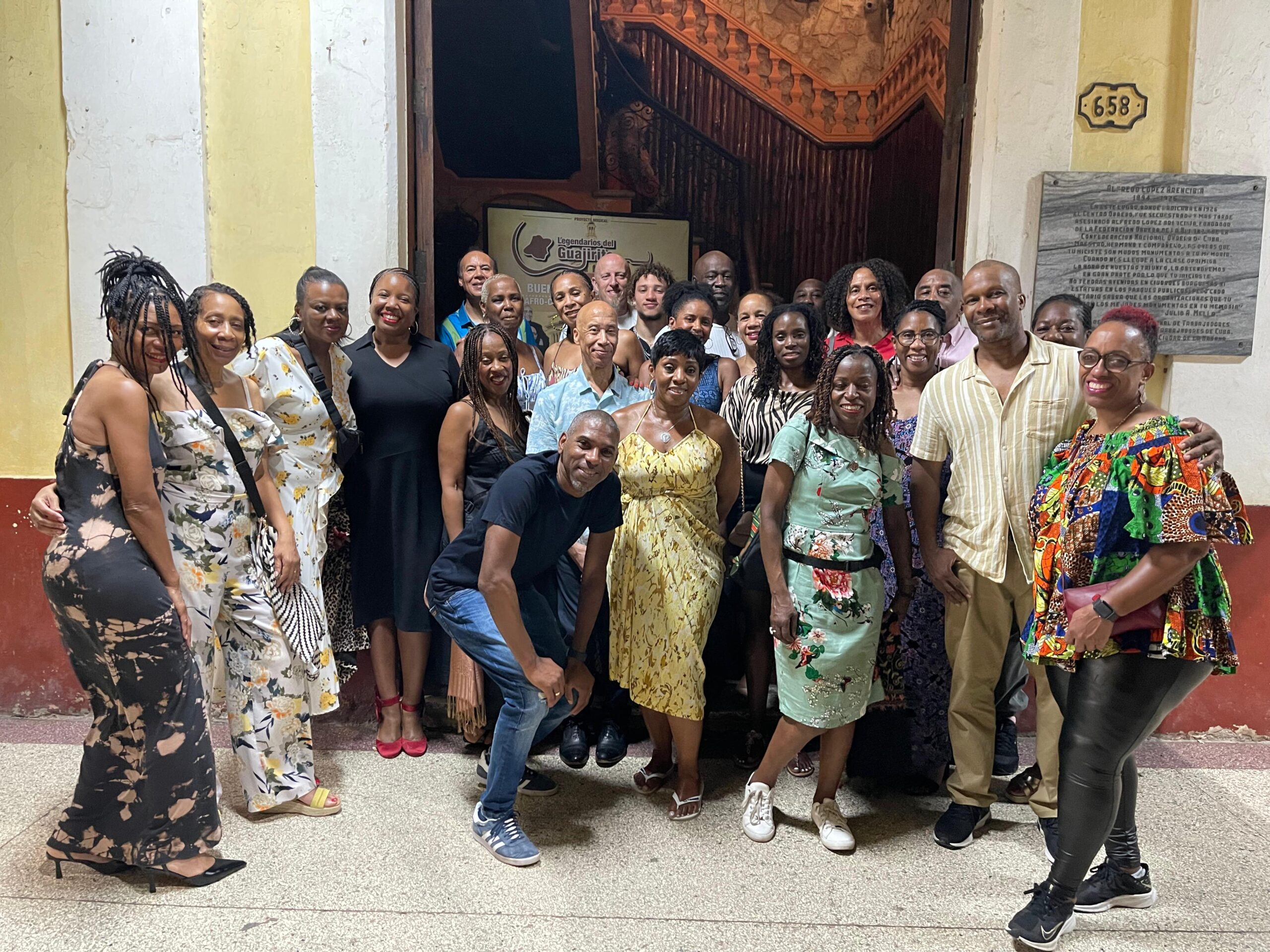 Travellers posing outside Buena Vista Social Club